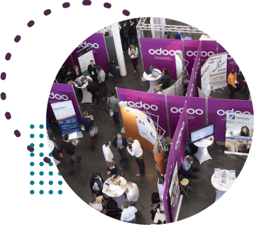 Odoo exhibitors talking with attendees at booths.