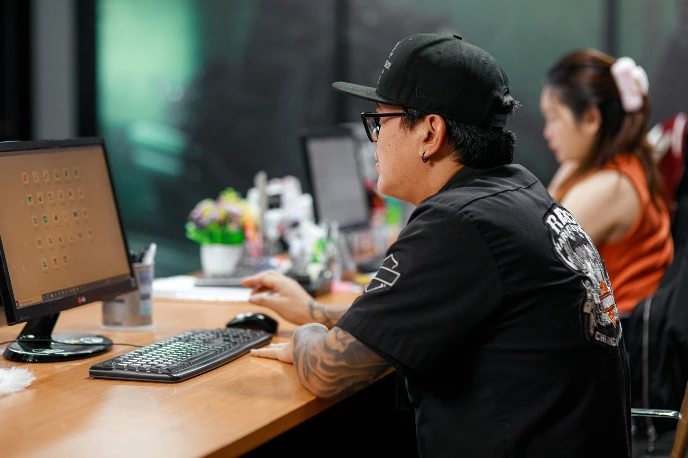 Staff working on computer using Odoo