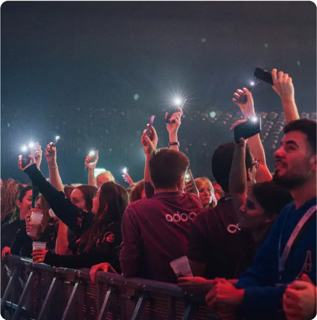 People at a concert having fun in the dark