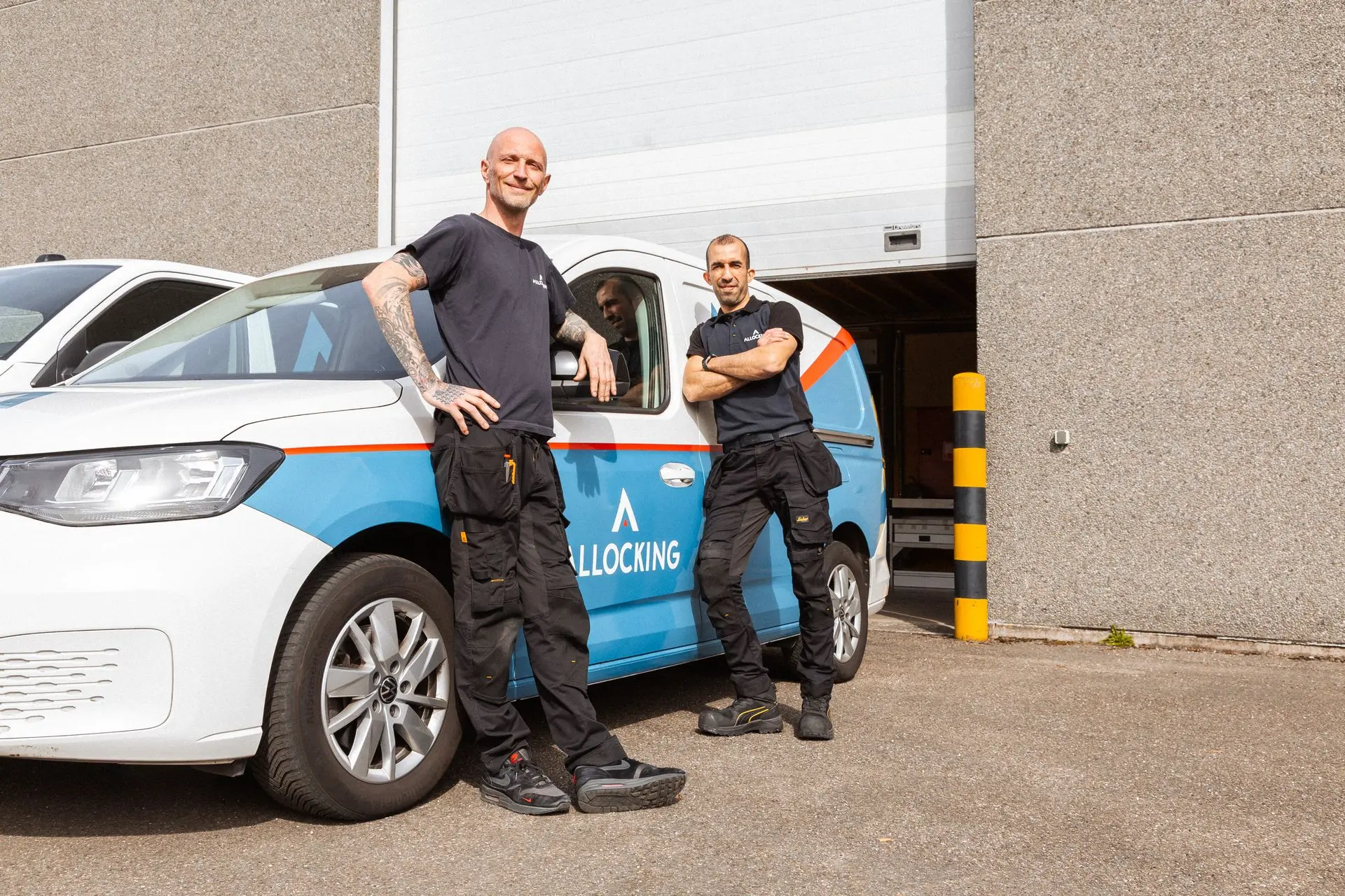 Allocking's team in front of a vehicle 